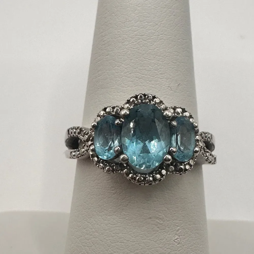 1.25ctw Swiss‎ blue topaz and genuine diamond accents in stamped .925 ring!!
